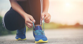 Female Runner Tying Shoes